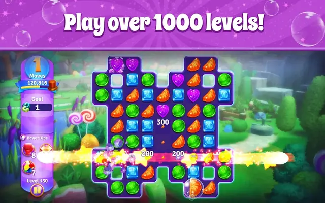 Wonka's World of Candy Match 3 puzzle board filled with coloured candy pieces above a garden background